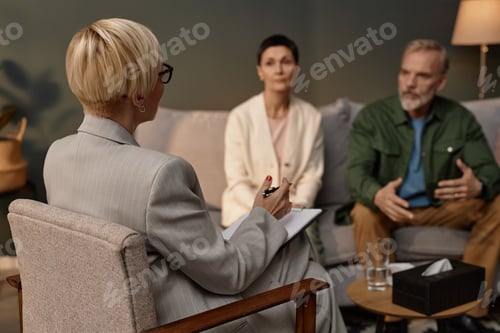 Preview: Adult couple talking to female psychologist