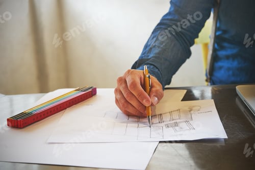 Preview: Architect man sketching a kitchen in his office
