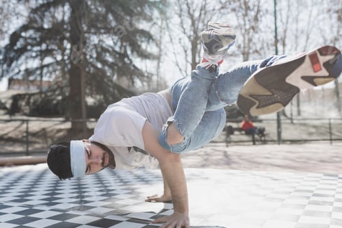 Preview: Man dancing break dance in park