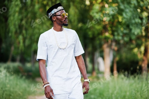Preview: Portrait of stylish and rich black african american man on white clothes, sunglasses and hat
