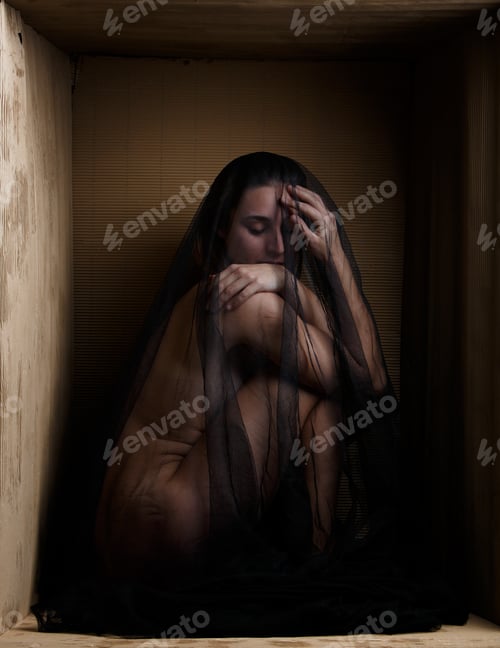 Preview: Sensual model under veil sitting in box