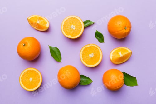 Preview: Fruit pattern of fresh orange slices on colored background. Top view. Copy Space