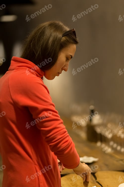 Preview: young girl tasting wine at a winery