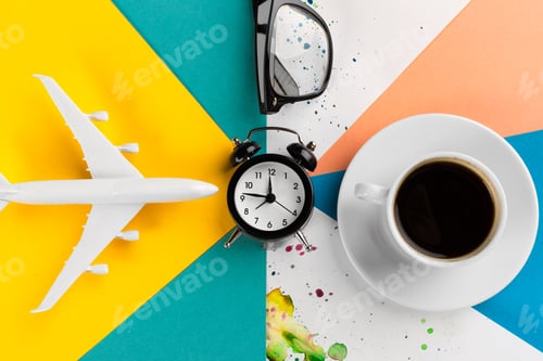 Preview: Time to travel concept. plastic plane jet toy passenger with alarm clock