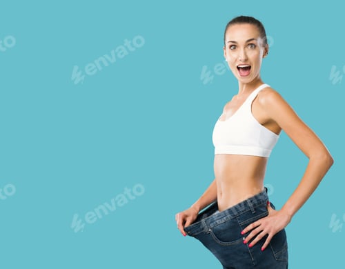 Preview: Happy woman showing her successful weight loss