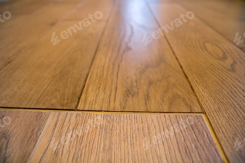 Preview: Natural light brown wooden parquet floor boards. Sunny soft yellow texture, copy space perspective