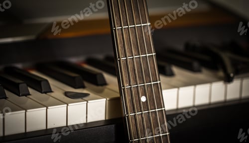 Preview: musical instruments piano keys and acoustic guitar