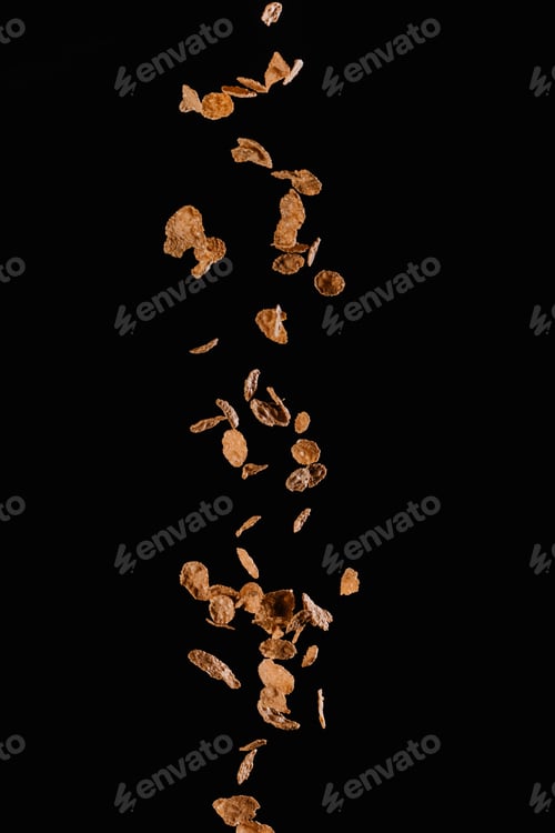 Preview: falling yummy cornflakes isolated on black