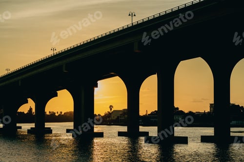 Preview: Beautiful view of the bridge over the river during the golden sunset