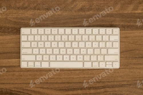 Preview: Top View Of Modern White Computer Keyboard On Dark Wooden Desk