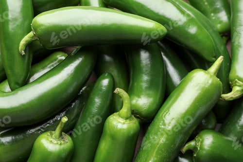 Preview: Fresh green jalapeno peppers on table, closeup