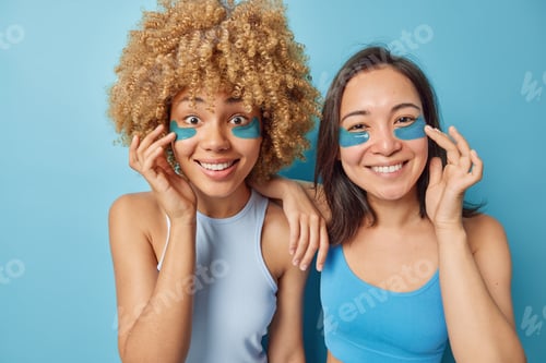 Preview: Photo of female friends apply hydrogel patches to reduce puffiness around eyes undergo beauty proced