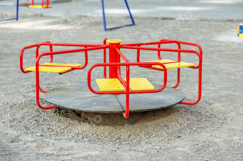 Preview: Red carousel in the playground. The concept of childhood, parenting, games.