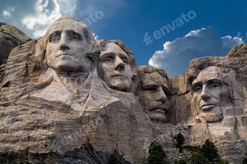 Preview: Sculpture memorials at Mount Rushmore against blue cloudy sky