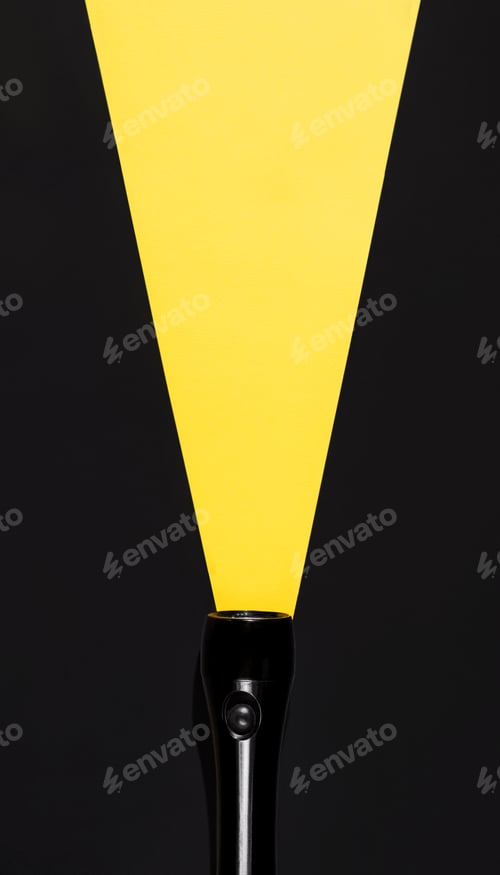 Preview: Flashlight with luminous beam made of paper, top view. Search concept, copy space. Creative vertical