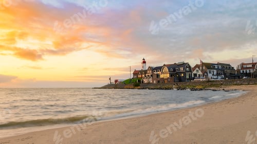 Preview: Urk Flevoland Netherlands sunset at the lighthouse and harbor of Urk Holland. Fishing village Urk
