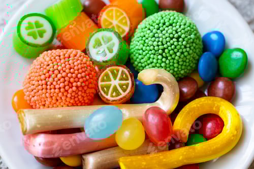 Preview: Colorful lollipops and different colorful round candy. Top view.