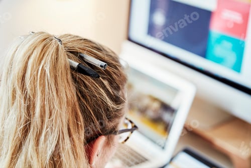 Preview: Over the shoulder view, woman at a workstation