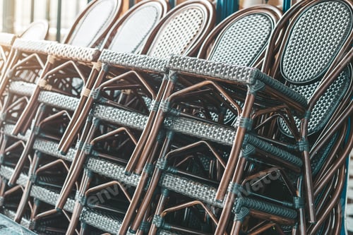 Preview: Stack of identical rattan chairs