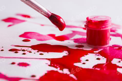 Preview: Paintbrush with Red Paint over Splattered Background