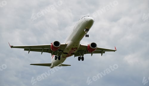 Preview: Commercial airplane flying in the sky.