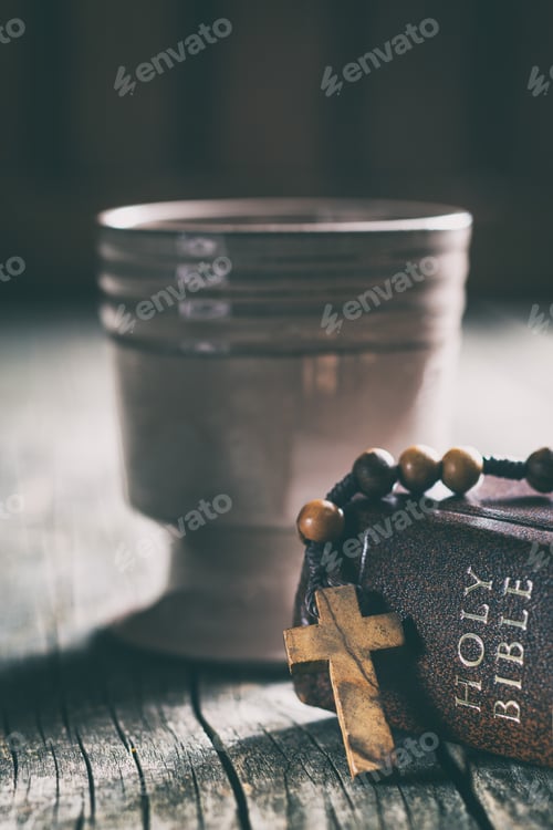 Preview: Rosary beads, holy bible and cup of wine.
