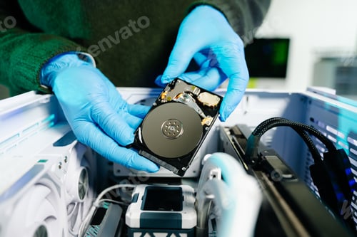 Preview: Showcasing expert computer hardware assembly and hard drive installation with precision