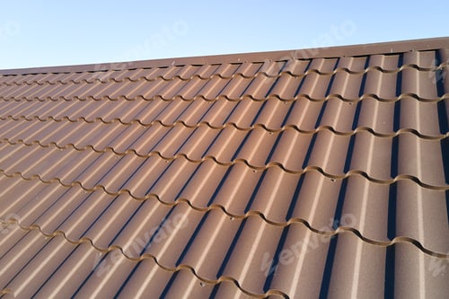 Preview: Closeup of house roof top covered with metallic shingles