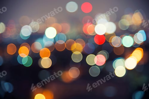 Preview: Abstract background image of circular bokeh motion blurred street light background of city.