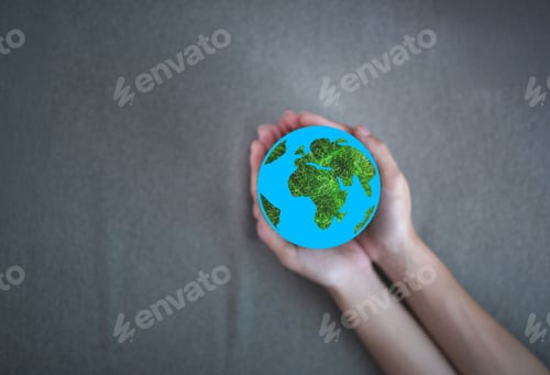 Preview: A hand holding a globe with green continents