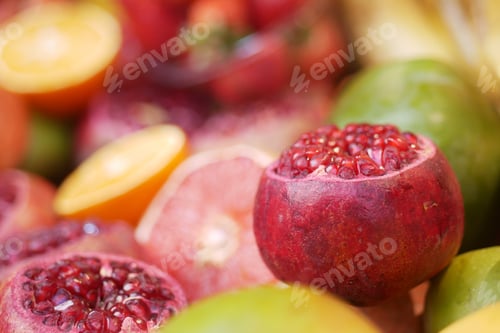 Preview: Colorful assortment of pomegranates and citrus fruits