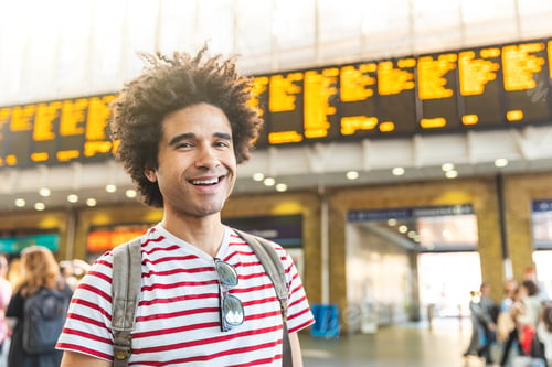 Preview: Happy man portrait at train station in London