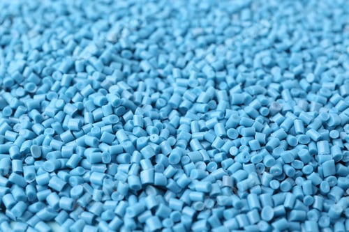 Preview: Pile of light blue plastic granules as background, closeup