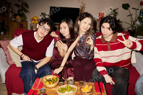 Preview: Group of Young Adult Friends Celebrating Tet Holiday and Posing for Camera