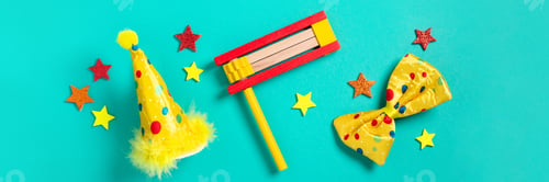 Preview: Purim carnival frame with traditional cookies, costume accessories and decor on bright green backgro