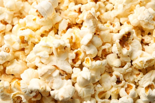 Preview: Delicious popcorn on whole background, close up