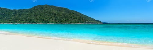 Preview: Tropical beach with turquoise clear sea and white sand panorama