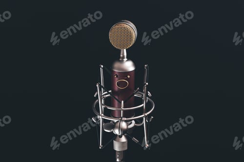 Preview: Close up of vintage microphone on a black background.