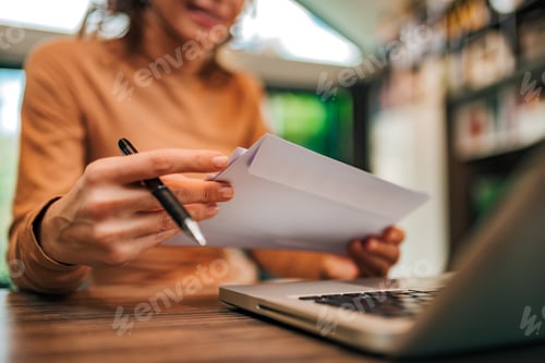 Preview: Close-up image of a woman holding letters, copy space..