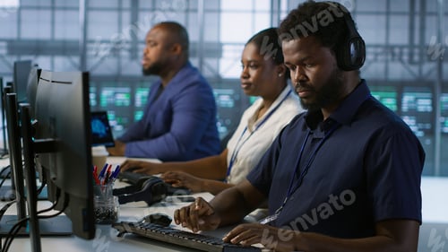 Preview: Data center admin typing on keyboard, maintaining company infrastructure