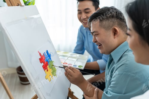 Preview: Asian happy family draw picture with young son in living room at home.