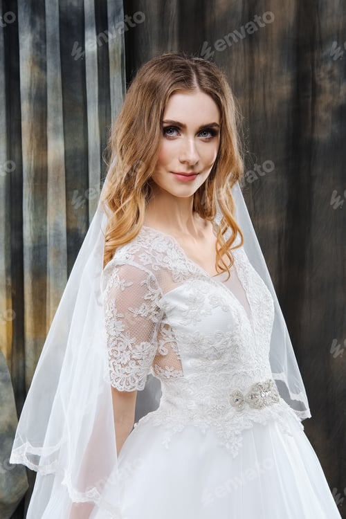 Preview: Woman in Wedding Dress with Veil Posing