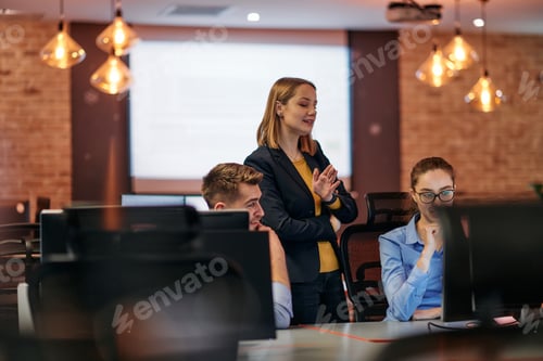 Preview: Strategic Business Meeting: Group of Professionals Collaborating in Office Using Computers