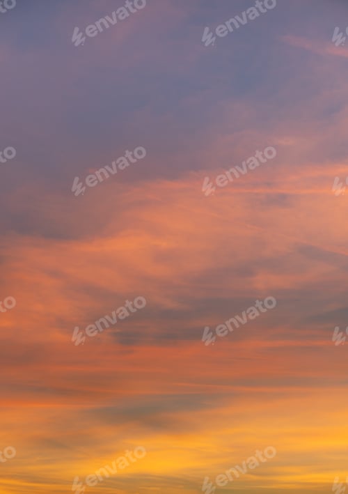 Preview: Vertical shot of orange clouds with a scenery of sunrise