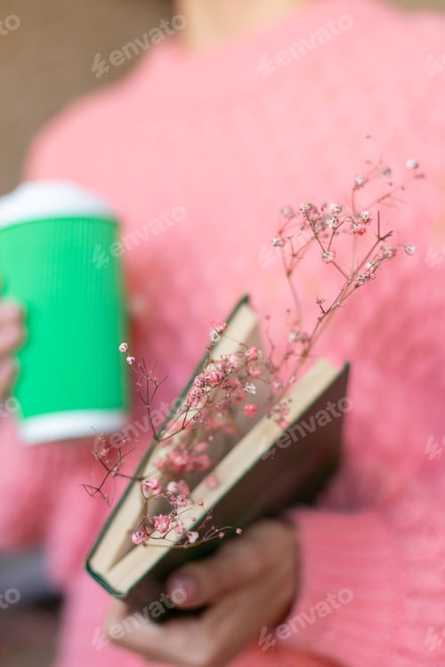 Preview: Woman holding book