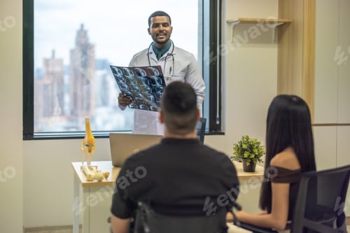 Preview: Orthopedic doctor with MRI result, upcoming surgery. Focus on rehabilitation for effective healing