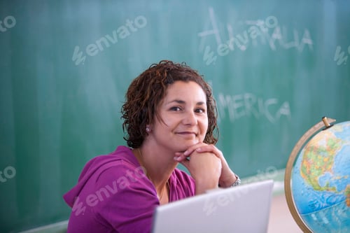 Preview: Portrait of teacher in front on blackboard