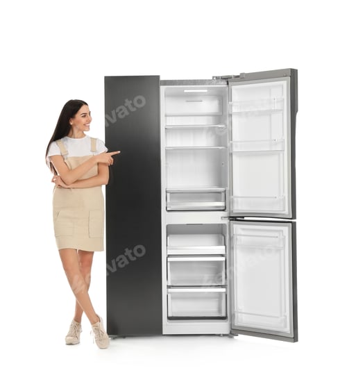 Preview: Young woman near empty refrigerator on white background