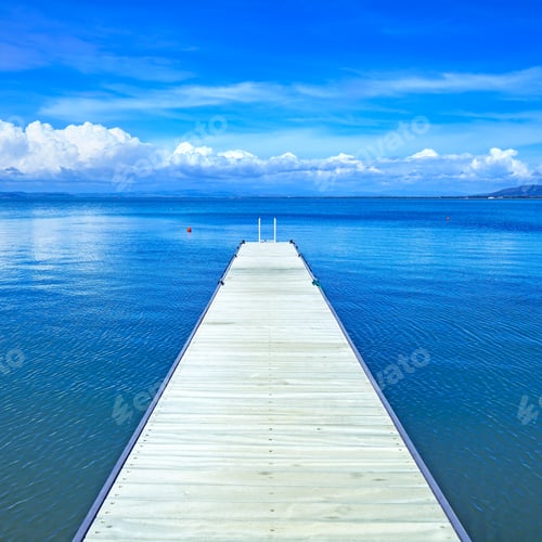 Preview: Wooden pier or jetty on a blue ocean. Beach in Argentario, Tuscany, Italy