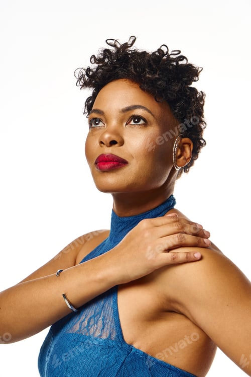 Preview: Stylish african american woman posing confidently in modern attire against a bright backdrop